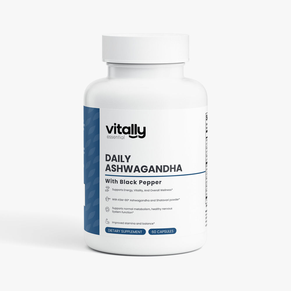 A white plastic bottle of Vitally Essential Daily Ashwagandha dietary supplement with black pepper, featuring a white label with blue accents and a white cap, set against a light gray background.