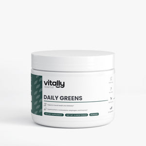 A white plastic jar of Vitally Essentials Daily Greens powder supplement, featuring a white label with a dark green side accent and black text, set against a clean white background.