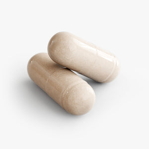 Two beige capsules on a white background