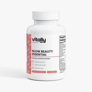 A white plastic bottle of Vitally Essentials Glow Beauty Essential dietary supplement, featuring a white label with pink accents and a visible supplement facts panel on the side, set against a clean white background.