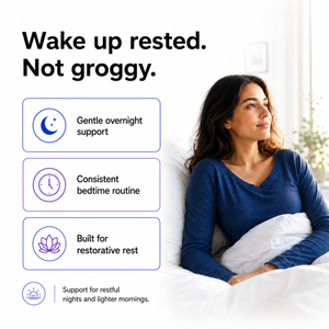 A woman in a blue long-sleeve top sits in bed under white bedding, with marketing text on a white background reading 'Wake up rested. Not groggy.